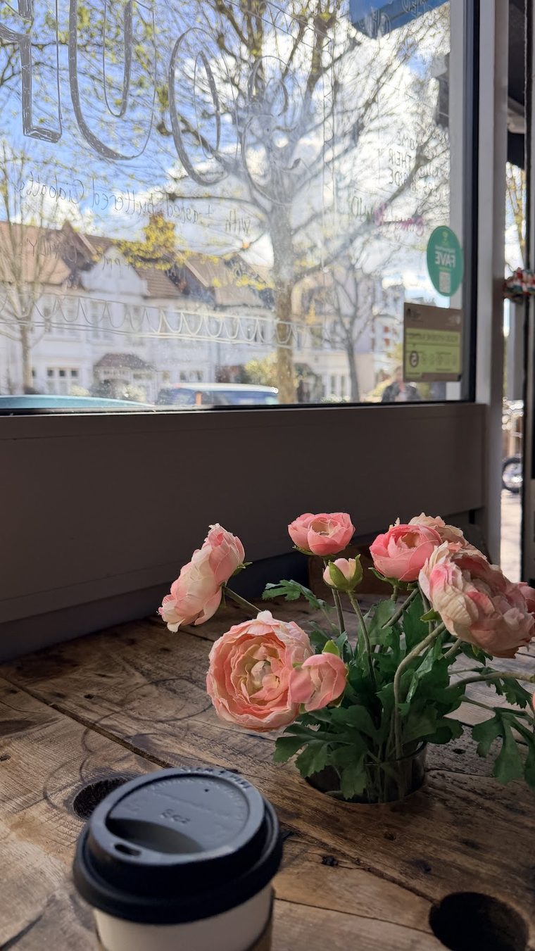 Takeaway coffee on the window bench